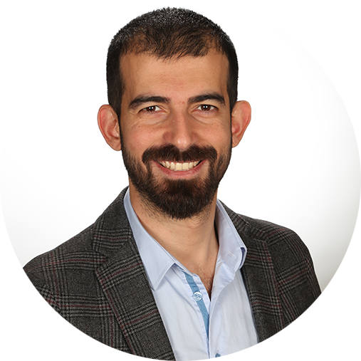 Kazim Etiksan in grey suit dress | Software Development